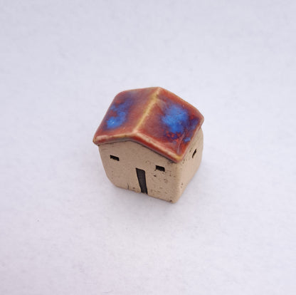Red/ Bright Blue Roofed House